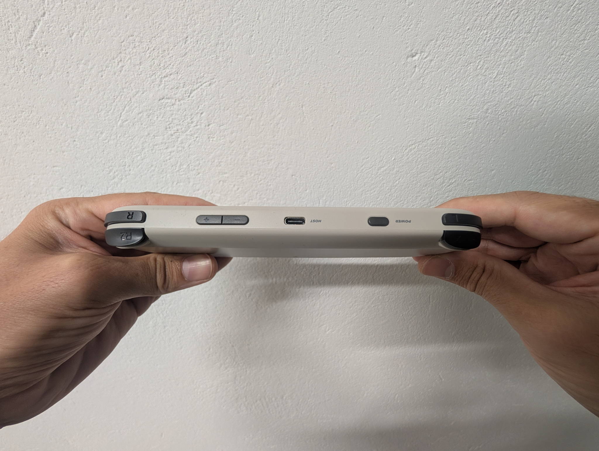 TrimUI Smart Pro rear view showing the shell and shoulder button layout