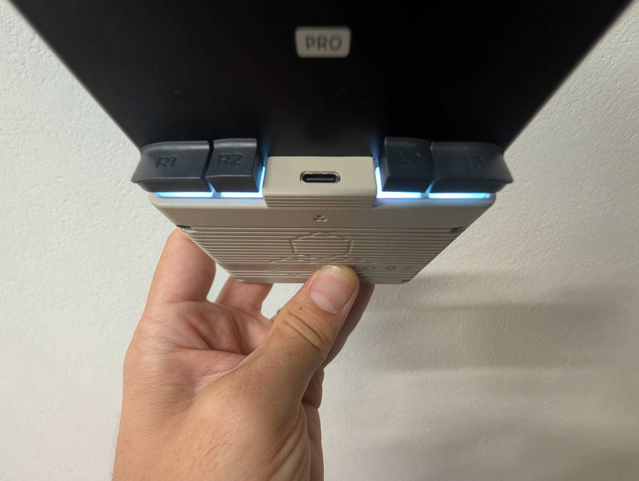 TrimUI Brick Pro in Retro Grey, three-quarter view